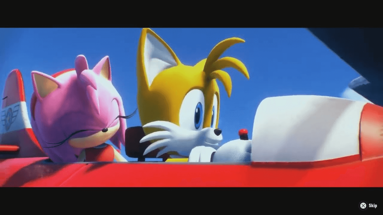 Screenshot from a cutscene in Sonic Frontiers, as it was shown in the live stream. Amy and Tails sitting in the bright red Tornado biplane, both smiling, under a blue sky.